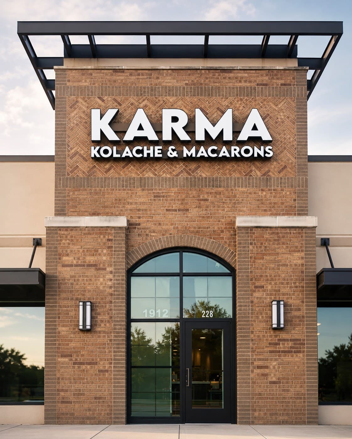 Dimensional letters for Karma Kolache & Macarons on a brick tower facade